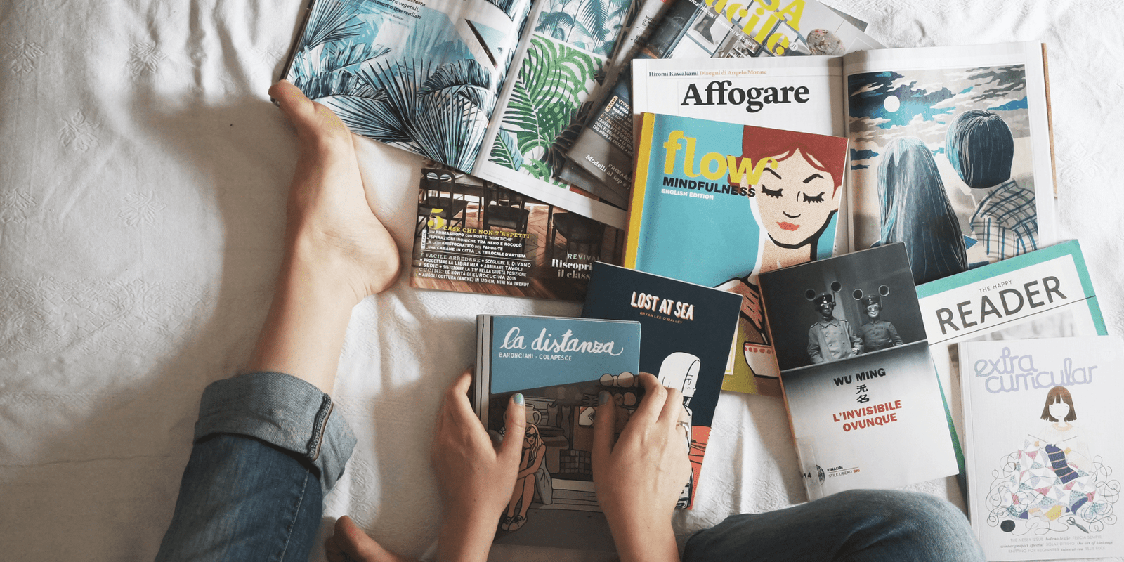 An assortment of books on a bed