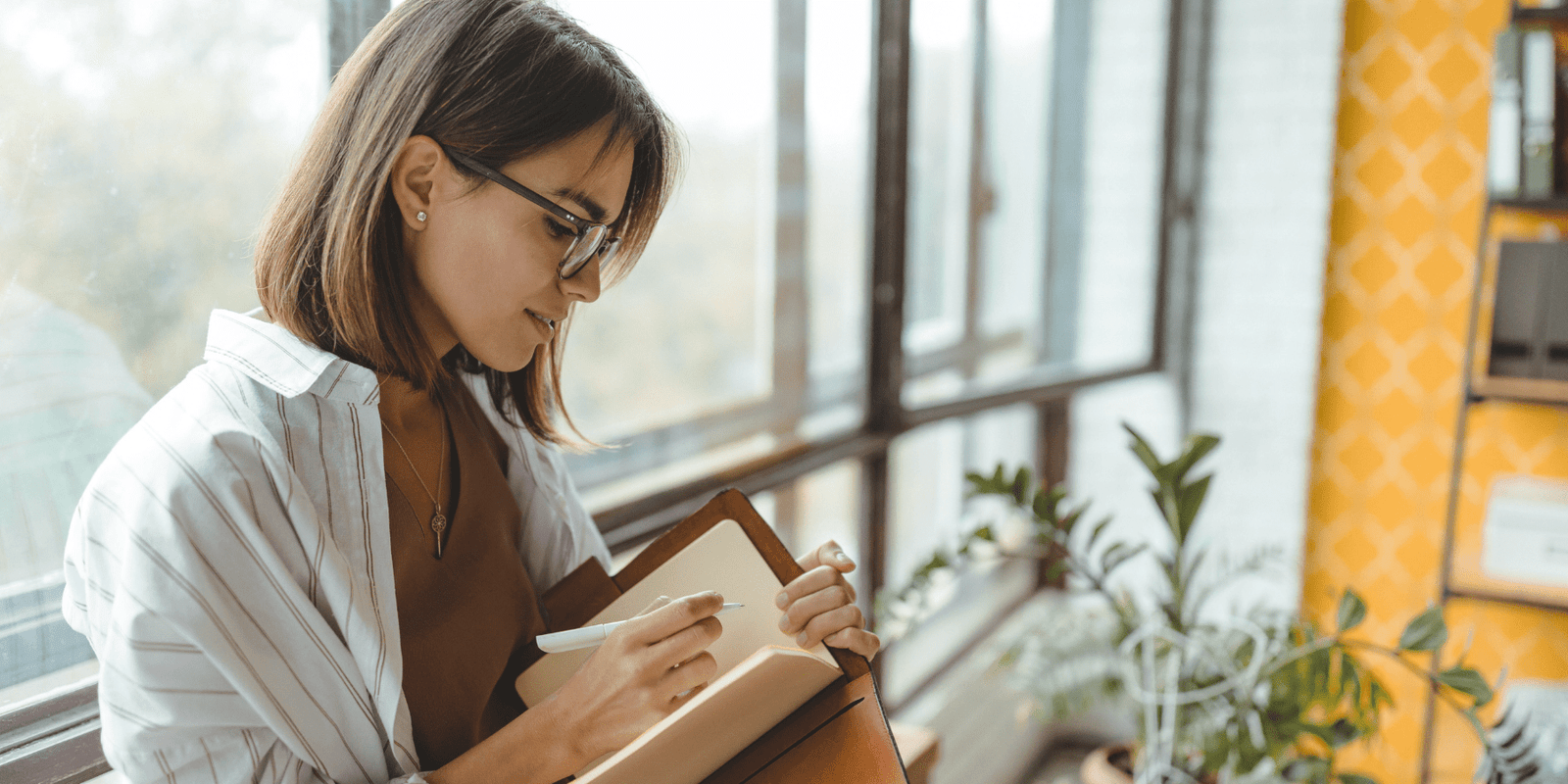 Woman writing in her journal